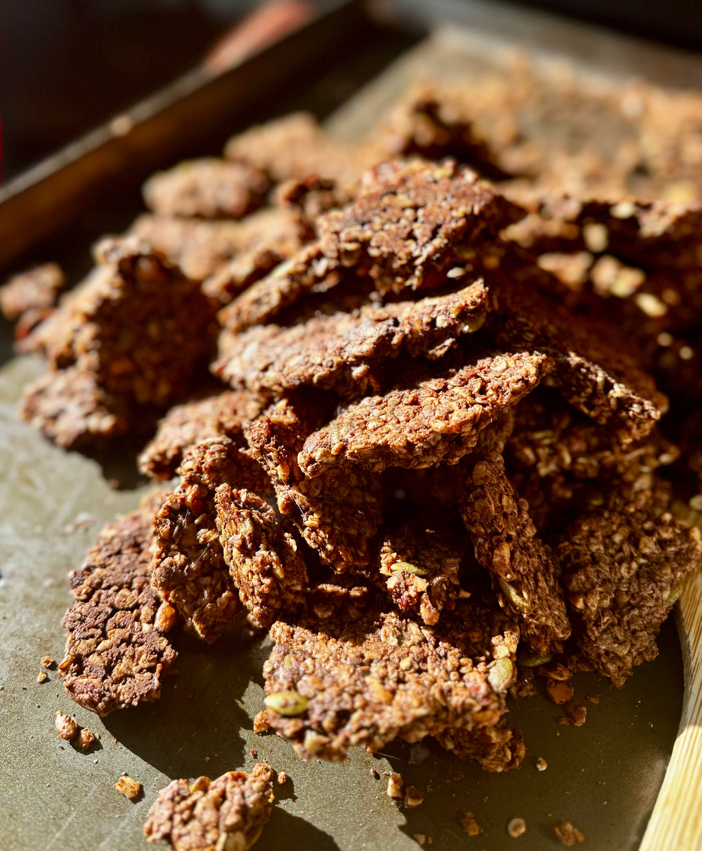 Deep Forest Granola clusters piled on a baking sheet