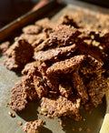 Deep Forest Granola clusters piled on a baking sheet